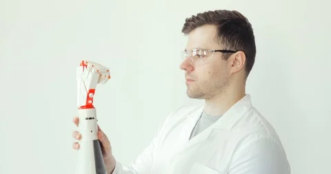 Engineer scientist is attentively studying and testing robotic prosthesis hand Stock Footage 106221022