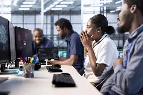 Engineer in server farm frightened by hacker passing firewall and stealing data Stock Photos