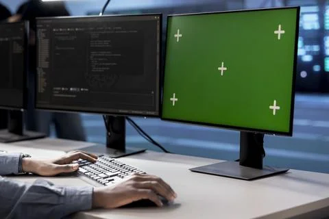 Engineer in server hub using chroma key PC to repair equipment storing datasets 스톡 사진