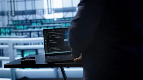 Engineer in server hub works with artificial intelligence computerized model Stock Footage 277643309