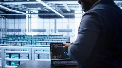 Engineer in server hub works with artificial intelligence computerized model 스톡 사진