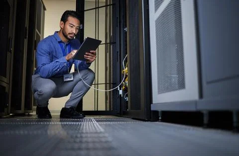 Engineer, server room and man with tablet for database connection cable Stock Photos