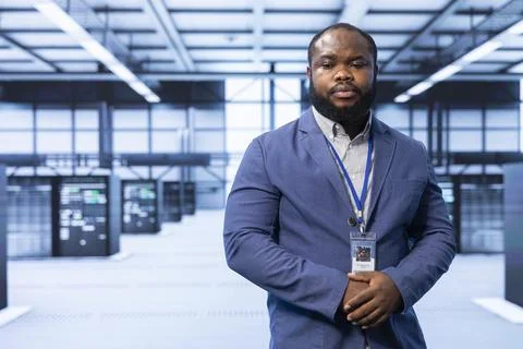 Engineer in server room implementing and maintaining security measures 스톡 사진