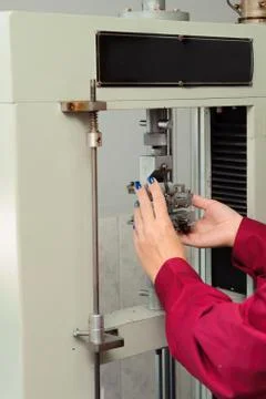 Engineer set up and testing old machine in factory Foto stock