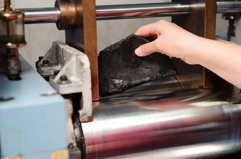 Engineer set up and testing old machine in factory Foto stock