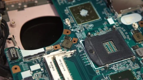 Engineer Sets the CPU Into the Motherboard Stock Footage 120016080