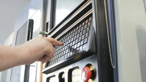 Engineer Sets Program on Modern Machine Control Panel Stock Footage 72927496