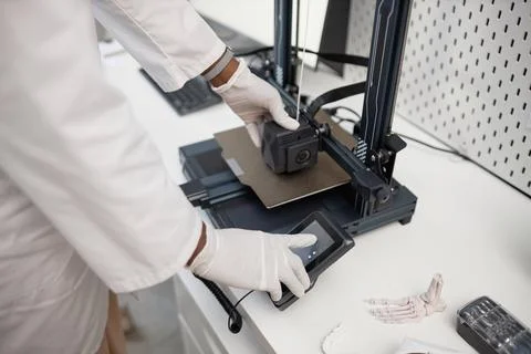 Engineer Setting up 3D Printer with User Interface Stock Photos