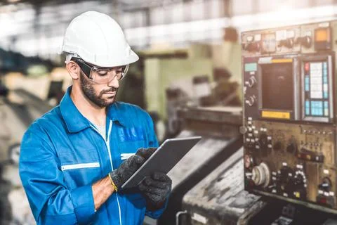 Engineer setup the CNC machine with G-Code programming upload from Computer T Stock Photos