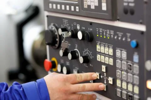 Engineer setup operation parameters of CNC lathe Stock Photos