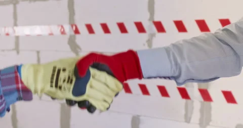 Engineer shakes hands with coworker preparing to begin work Stock Footage 309928644