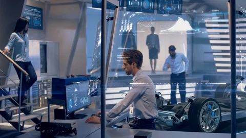 Engineer shows Client a Concept of Electric Vehicle. Stock Footage 119731832