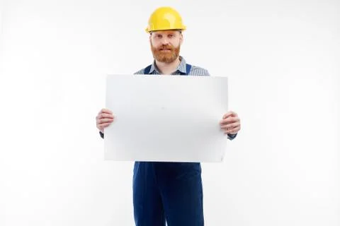 Engineer shows drawings to the camera on a white background. Stock Photos