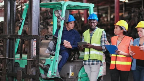 Engineer sit on forklift and talk with his friend Stock-Footage 142523774