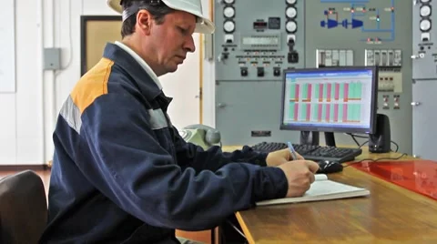 Engineer Sits And Writes Log Video stock 8659502