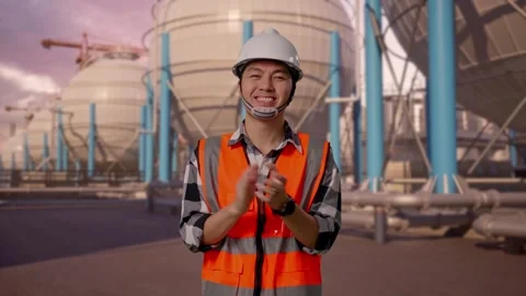 Engineer Smiling And Clapping His Hands with Spherical Tank Stock Footage 335067341