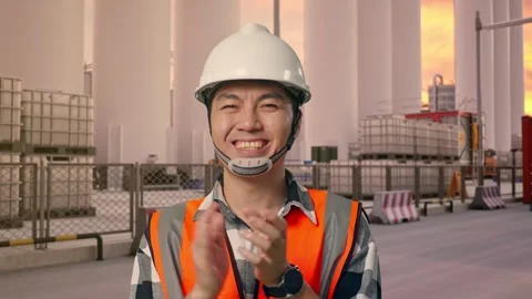 Engineer Smiling And Clapping His Hands at Storage Facility Stock Footage 335076943