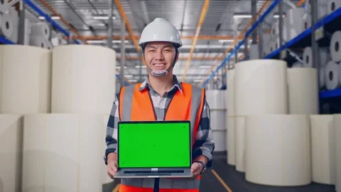 Engineer Smiling And Showing Green Screen Laptop at Polymer Plant Stock Footage 334524579