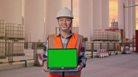 Engineer Smiling And Showing Green Screen Laptop at Storage Facility Stock Footage 335076302