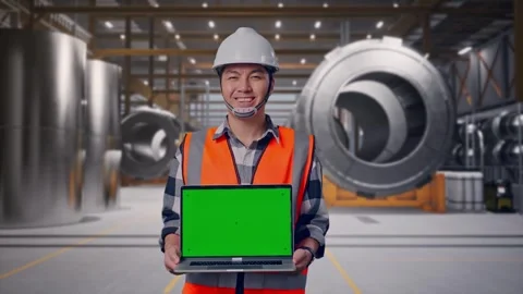 Engineer Smiling And Showing Green Screen Laptop at Heavy Factory Stock Footage 340817456