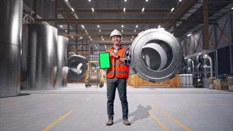 Engineer Smiling And Showing Green Screen Tablet at Heavy Factory Stock Footage 340821351