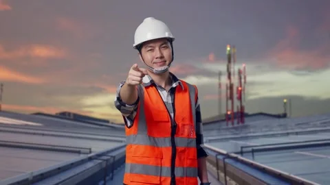 Engineer Smiling And Touching His Chest Then Pointing on Solar Rooftop Stock Footage 318815837