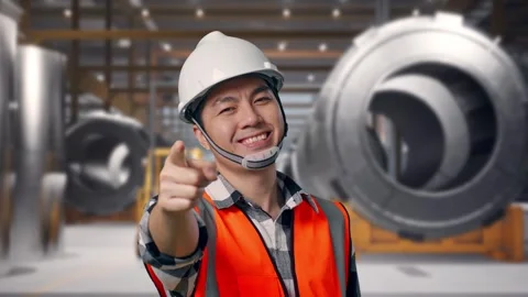 Engineer Smiling And Touching His Chest Then Pointing at Heavy Factory Stock Footage 340818978