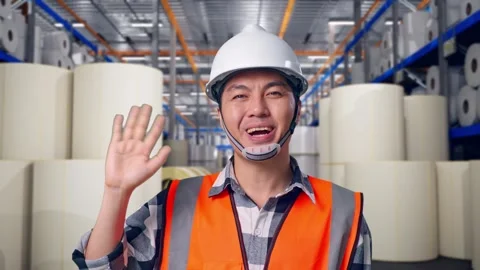 Engineer Smiling And Waving Hand Saying Bye at Polymer Plant Stock Footage 334525865