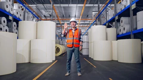 Engineer Smiling And Waving Hand Saying Bye at Polymer Plant Stock Footage 334528017