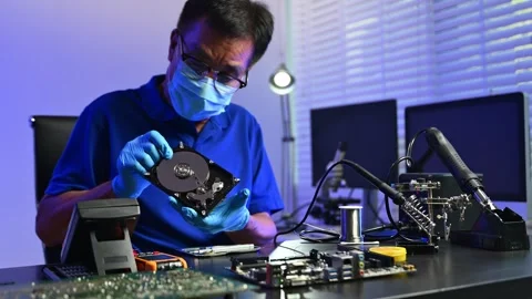 Engineer soldering circuit board in clean tech lab with gloves and tools. I.. Stock Footage 312774075