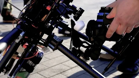 The engineer stabilizes the camera on the copter. Stock Footage 75826221