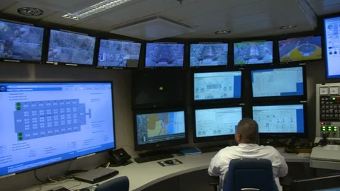 Engineer staff members working in control room to check the system status Stock Footage 116417864