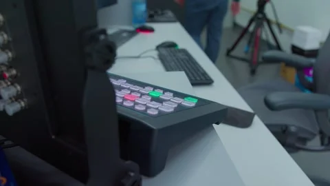 An engineer stand up and go to check electricity in TV control center Video stock 277134648