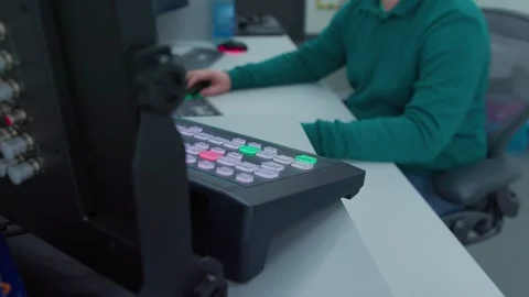 An engineer stand up and go to have some rest in TV control center Stock Footage 274348181