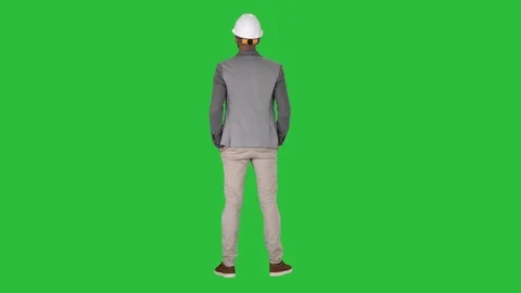 Engineer standing and looking around on a Green Screen, Chroma Key. Stock-Footage 108114331