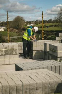 Engineer standing between the concrete slabs using tablet 스톡 사진