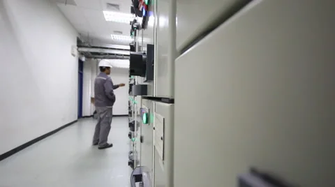 Engineer standing in front of the control panel in the control room 库存影片 49965657
