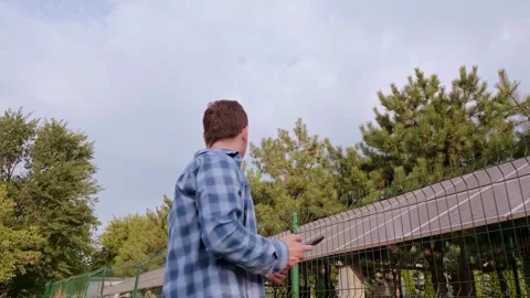 Engineer standing with his back, calculating the optimal placement and tilt of s Stock Footage 300250161