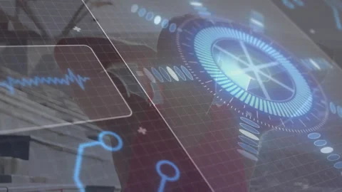 Engineer standing before power plant cooling tower, displaying digital HUD Stock Footage 307550632