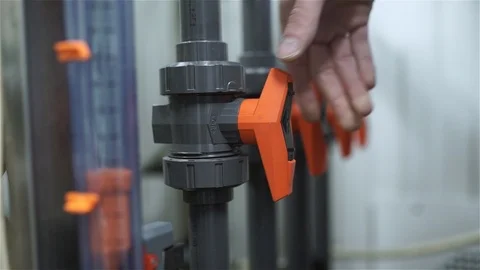 The engineer starts the blower and opens the valves from PVC Stock Footage 92581475