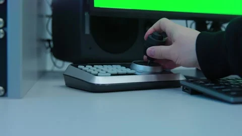 An engineer starts using a knob on a control panel Video stock 277475304