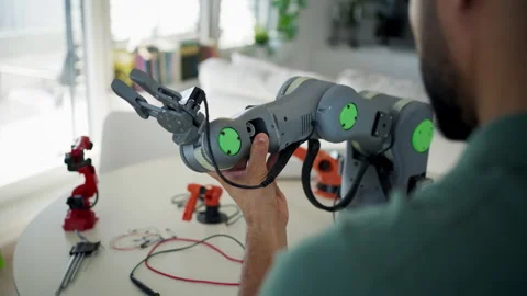 Engineer struggling with a technical problem while building robotic arm. Stock Footage 310209615