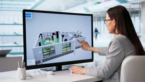 Engineer Studies House Plans Carefully In Modern Office Stock Footage 331523051
