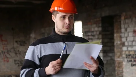 The engineer studies the working documents in the production. 스톡 동영상 73455265