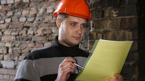 The engineer studies the working documents in the production. Stock Footage 73458324