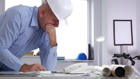 Engineer Study and Analyze Drafts and Projects of Building Design Stock Footage 97939984