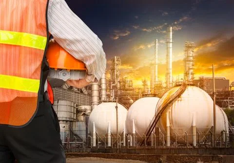Engineer survey of oil refiner Stock Photos
