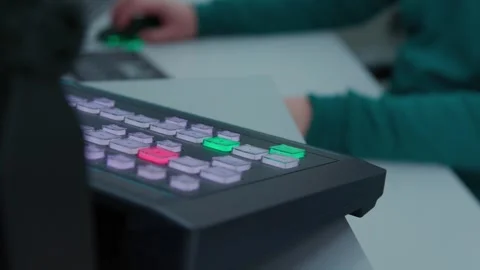 An engineer switching channels on black control panel Stock Footage 274136304