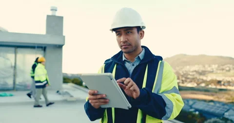 Engineer, tablet and man at construction site with inspection, typing report and Stock Footage 345575154
