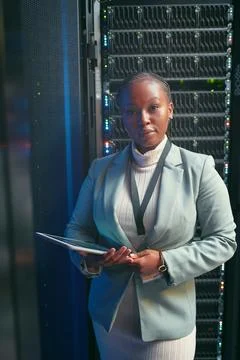Engineer, tablet and portrait of black woman in server room for database Stock Photos